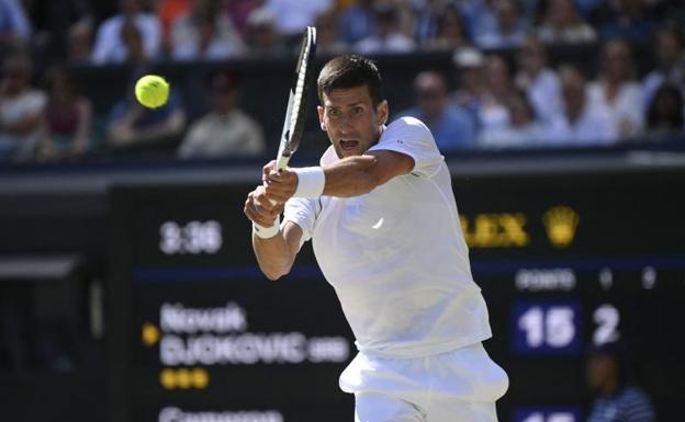 Novak Djokovic hits a shot in the semi-final against Cameron Norrie